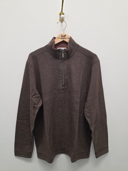 A dark brown quarter-zip pullover sweater hanging on a wooden hanger against a plain light gray wall.