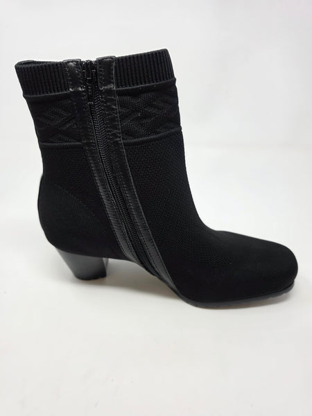A single black ankle boot with a side zipper, textured knit upper, and low block heel, photographed against a plain white background.