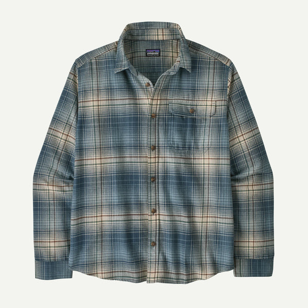 A Patagonia long-sleeve button-up flannel shirt in a blue, beige, and brown plaid pattern, shown against a light off-white background.
