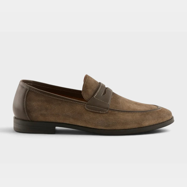A single brown suede penny loafer shown in a side profile view against a light gray background.