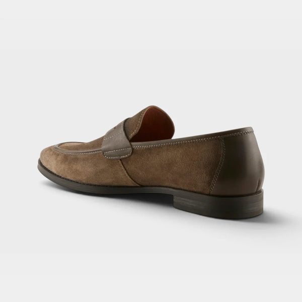 A single brown suede and leather loafer shown from a three-quarters rear angle on a light gray background.