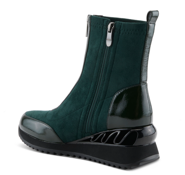 A dark green ankle boot with a black sole, featuring a side zipper, a glossy patent leather toe cap, and a sculpted black heel, shown against a plain white background.