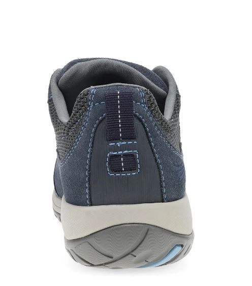 A close-up rear view of a navy blue athletic shoe with gray and white accents, showing the heel, textured mesh upper, and sole.