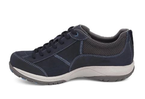 A navy blue low-top casual sneaker with a textured mesh upper, matching navy laces, and a thick white and gray midsole, shown from a side profile on a white background.