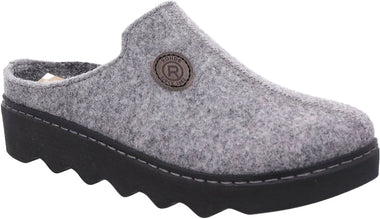 A gray felt clog shoe with a black wavy sole and a circular metal brand badge on the side.