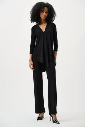 Woman wearing a black outfit on a white background